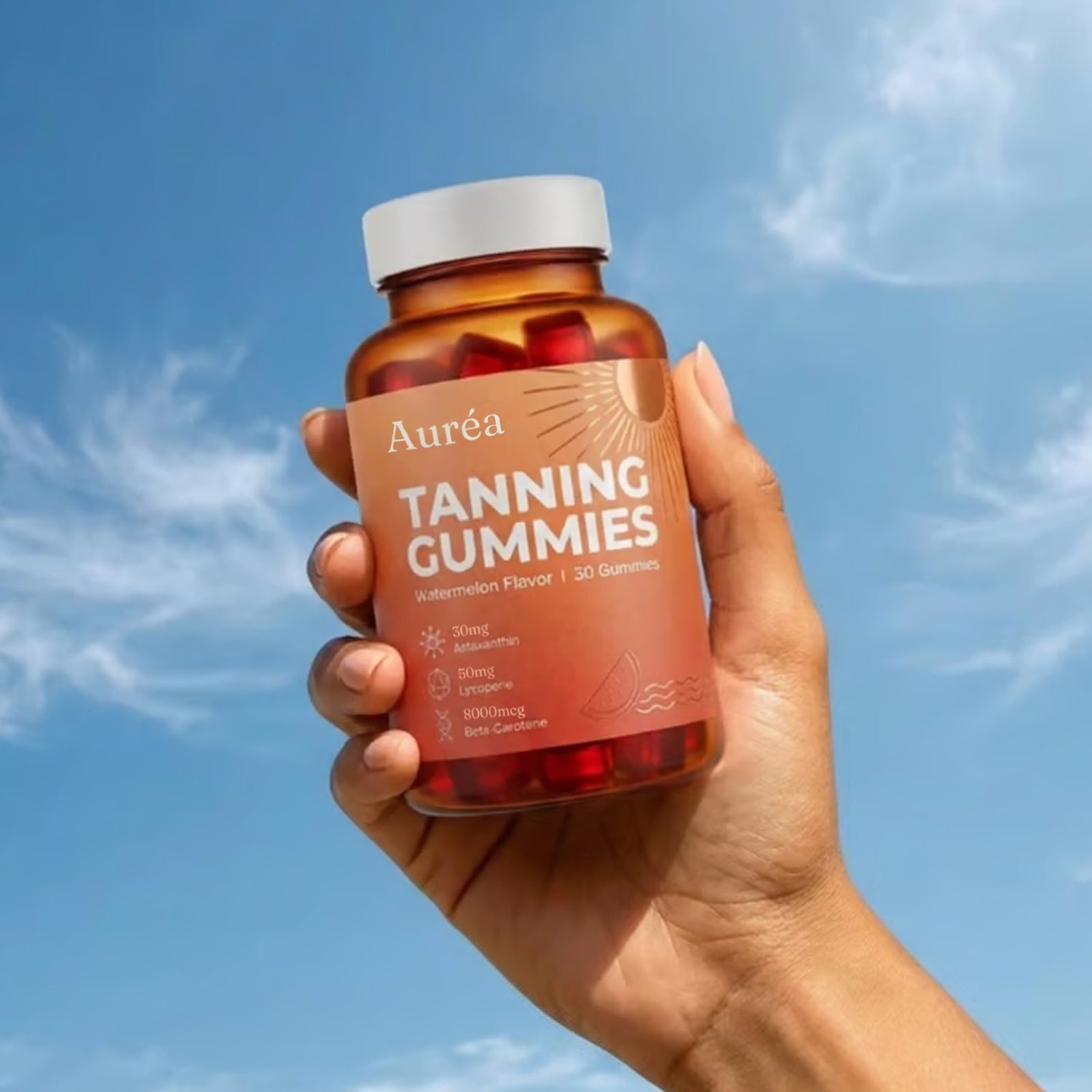 Auréa Tanning Gummies jar against a clear blue sky